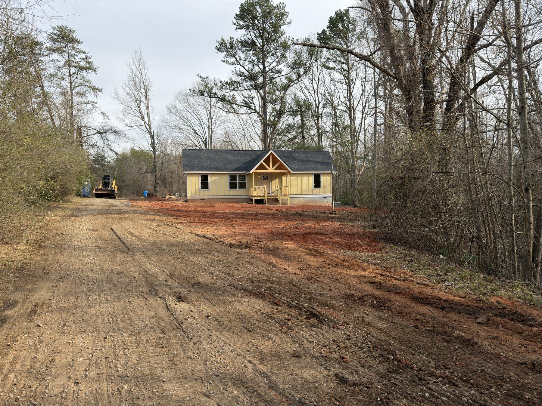 Cleaned residential drive and property edge after cleanup